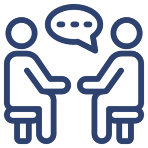Group psychotherapy icon featuring two simplified human figures sitting on chairs facing each other with a speech bubble containing three dots between them, symbolizing communication and therapeutic conversation in a group setting.