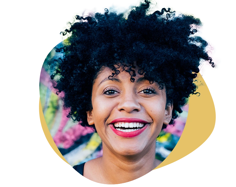 A confident woman smiling as part of her New Year's resolution for better mental health and personalized therapy with Turnwell.